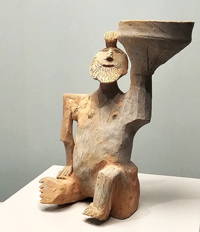 Pottery lamp with figurine stand Western Han dynasty (202 BCE - 8), Collection of Guangzhou Municipal Institute of Cultural Heritage and Archaeology, Han dynasty