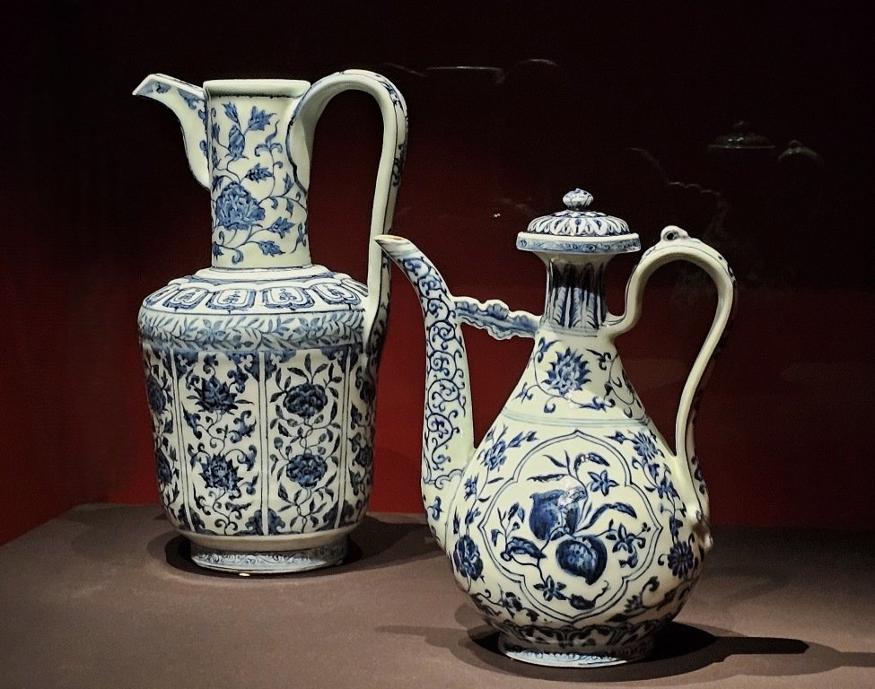 Left: Ewer with floral scrolls, Jingdezhen kilns, Ming dynasty, Yongle period (1403-1424), Porcelain with underglaze cobalt blue, The Palace Museum, Right: Ewer with fruit sprays, Jingdezhen kilns, Ming dynasty, Xuande period (1426-1435), Porcelain with underglaze cobalt blue, The Palace Museum, Forbidden City and the World