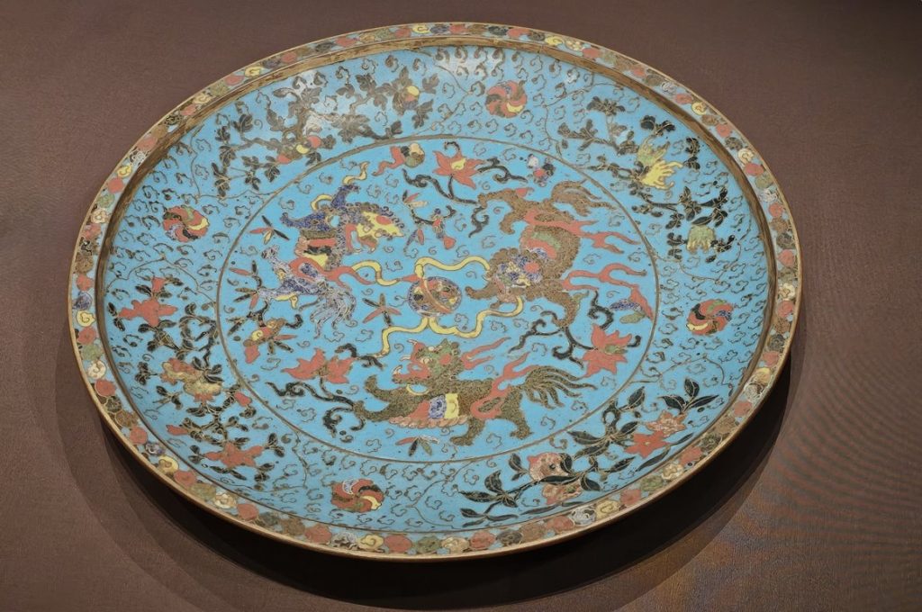 Plate with lions playing with a ball and Floral scrolls, Forbidden City and the World
